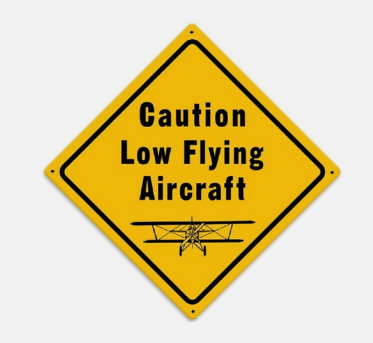 Caution low flying aircraft sign